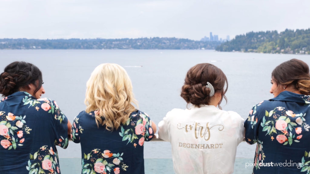 bridal party at the hyatt regency south port look at view of seattle wedding videographer