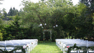 ceremony site under a tree at the robinswood house in bellevue captured for a wedding video