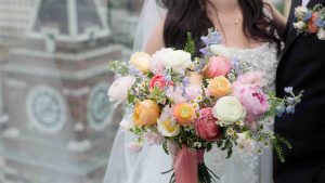 Seattle bride standing infront of pioneer Square clock tower